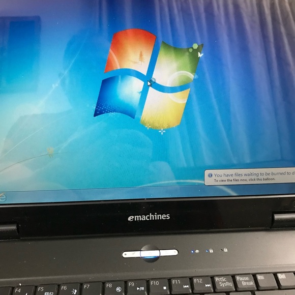 e machine laptop 15 inches screen. Very new with charger.. all features shows
